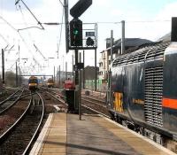 Haymarket 3 March 2007. A Kings Cross - Aberdeen HST pulls out of platform 2 as Waverley bound services approach 1 & 3.<br><br>[John Furnevel /03/2007]