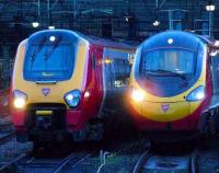 221115 passes 390022 as it departs for Plymouth from Glasgow Central.<br><br>[Graham Morgan 17/02/2007]