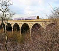 An Edinburgh - Markinch service slows over the viaduct on the approach to its destination on 13 March 2007.<br><br>[John Furnevel 13/03/2007]