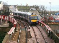 An Edinburgh bound train crossing the bridge over Burntisland High Street on 15 March 2007, shortly after leaving Burntisland station.<br><br>[John Furnevel 15/03/2007]