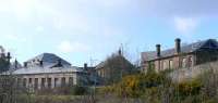 Burntisland original station platform building (left) and present station building on the higher plane. When the Forth Bridge opened in 1890 the new (r) line opened.<br><br>[Brian Forbes 15/05/2007]