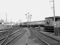 A pair of class 47s take a northbound train past Ferryhill MPD in 1974.<br><br>[Bill Roberton //1974]