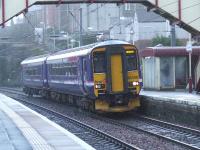 156450 racing through Johnstone with the early morning Stranraer service.<br><br>[Graham Morgan 03/03/2007]