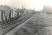 C.R. 0.6.0 57300 working Porterfield station - Renfrew (South) in background.<br><br>[G H Robin collection by courtesy of the Mitchell Library, Glasgow 08/05/1953]