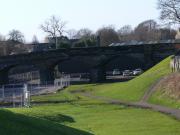 The abandoned trackbed of the Devon Valley Railway approaching the soon to be opened SAK. The regenerated line to the New Alloa station runs behind the fence to left at the first arch.<br><br>[Brian Forbes //2007]