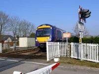 Dundee to Perth turbostar passing Grange LC east of Errol. Unit 170434.<br><br>[Brian Forbes 25/03/2007]