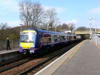 Guard checks for passenger safety, before he bells this 170 off up the hill to Dunblane.<br><br>[Brian Forbes 26/03/2007]