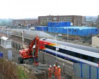 Workers discuss the weekend ahead. Here is the SWT 158786 again. Markinch station inprovements on 30 March.<br><br>[Brian Forbes 30/03/2007]