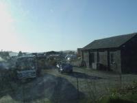 Station buildings at Oldmeldrum, still intact. Now a bus garage. Engine shed is at the right of the picture, and the bus to the extreme left sits on the station platform, also still intact. Looking West<br><br>[Graham Morgan 01/04/2007]