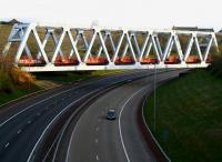 The Warren Truss bridge carrying the G&G line over the M80 motorway between Balornock and Robroyston, Glasgow. Looking north on a quiet Sunday morning in April 2010.<br><br>[John Furnevel 18/04/2010]