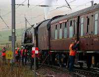 6233 Duchess of Sutherland takes on water in the down loop at Abington on 9 April during a break in <I>The Great Britain</I> railtour.  <br><br>[John Furnevel 09/04/2007]