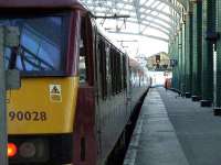 90028 at Glasgow Central with the terminated Caledonian Sleeper. Approaching is the driver of 67004.<br><br>[Graham Morgan 24/03/2007]