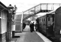 Boarding a northbound train at Grantown-on-Spey East in April 1961. (Old family photograph).<br><br>[Craig Seath Collection 15/04/1961]