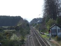 Looking west from the overbridge at Nairn, 158705 in the distance. Also in shot is the overgrown sidings and the signal box at the west side of the station.<br><br>[Graham Morgan 31/03/2007]