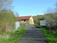 Looking east towards Paisley West, this is one reason why any reopened line to Kilmacolm will have to come from Elderslie. Housing estate built on the trackbed near Ferguslie Goods.<br><br>[Graham Morgan 12/04/2007]