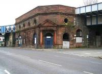 After crossing north-south over the Clyde the CGU line turned west at Gorbals Junction and shortly afterwards passed through Cumberland Street station. Originally opened as Eglinton Street by the GSW in 1900 the station was renamed in 1924. View south east across Cumberland Street towards the old station in March 2007 with the CGU line from Gorbals Junction and the Clydebridge Viaduct coming in from the left.<br><br>[John Furnevel 11/03/2007]