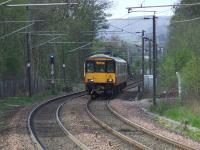 318263 coming up the hill towards Johnstone from the direction of Miliken Park with a Glasgow Central service.<br><br>[Graham Morgan 17/04/2007]