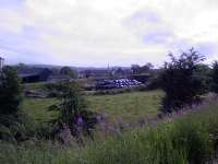 The plastic bags in the centre of shot are at the overbridge on the trackbed that led to Johnstone North. The trackbed in this area has now been put to use as farmland.<br><br>[Graham Morgan //2006]