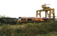 EWS 66059 awaiting the clear onto the ECML at Portobello on 13 April with a coal train off the Leith branch heading for Cockenzie power station. Taken from a passing train.<br><br>[John Furnevel 13/04/2007]