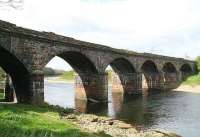 The bridge that once carried the Waverley route north over the River Eden, photographed looking west in April 2007. Carlisle Canal shed stood off to the left. The WCML river crossing is located around half a mile to the east at Etterby.<br><br>[John Furnevel 18/04/2007]