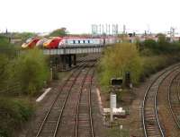 Voyager meets Pendolino on the WCML just south of Carlisle station. Below are the goods lines and to the right is the route from London Road Jct into Carlisle station.<br><br>[John Furnevel /04/2007]