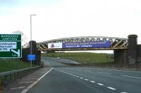 Carrying the R&C over the A8 (or the <I>M8 missing link</I>) in April 2007 is the structure referred to by many as <i>The Cutty Sark Bridge</i>, after the whisky ad which adorned it for many years. It is doubtful if the name <I>McArthur Glen Designer Outlet Centre bridge</I> will ever catch on in the same way.<br><br>[John Furnevel 28/04/2007]