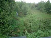 Caledonian Railway Lanarkshire and Dumbartonshire line, view of trackbed and sidings at Old Kilpatrick Goods Yard, looking E from bridge over Ferry Road.<br><br>[Alistair MacKenzie 25/04/2007]