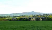 Fife Animal Park and Bistro, Collessie. The peak is East Lomond. A turbostar heads for Ladybank.<br><br>[Brian Forbes 26/04/2007]