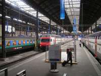 Basel Hbf...and an alternative meaning for the clockwork railway... you can literally set your clock by the railways here. The double decker commuter EMU on the left arrived exactly on time, as did the express on the right.<br><br>[Paul D Kerr 04/04/2007]