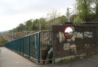 Panorama south over the footbridge at Bogston station in April 2007. The Gourock and Wemyss Bay lines approach from Wemyss Bay Junction (off to the left) with the former running through the platforms below and the latter via the embankment crossing the bridge directly ahead.   <br><br>[John Furnevel 29/04/2007]