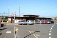 The closed and shuttered station building at Newton-on-Ayr in May 2007. View looks north west with Falkland Yard beyond the station.<br><br>[John Furnevel 03/05/2007]