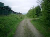 Caledonian Railway Lanarkshire and Dumbartonshire line, trackbed looking W at rear of Chivas Regal/Pernod/Ricard Plant.<br><br>[Alistair MacKenzie 04/05/2007]