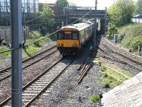 A northbound train from Ayr runs through Newton Junction past the branch to Ayr harbour on 3 May 2007. The train is about to call at Newton-on-Ayr station on its way to Glasgow Central.<br><br>[John Furnevel 03/05/2007]