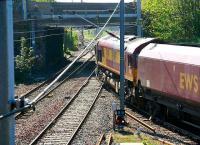 Empties for Killoch pull out of Falkland Yard to cross the Ayr-Glasgow main line at Newton Junction on 3 May 2007.<br><br>[John Furnevel 03/05/2007]