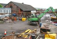 Looking west over the wall on Balmore Road just south of the former Possil station on 13 May 2007 - the old goods shed still stands in what is now a scrapyard.<br><br>[John Furnevel 13/05/2007]