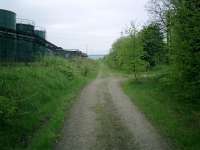 Caledonian Railway Lanarkshire and Dumbartonshire line, trackbed looking W at rear of Chivas Regal/Pernod/Ricard Plant.<br><br>[Alistair MacKenzie 04/05/2007]
