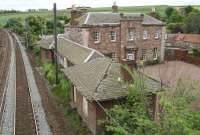 Looking east along the ECML from the old station footbridge at East Linton on 16 May 2007. The surviving platform buildings connect to the substantial structure incorporating the former <I>Station House</I> beyond.<br><br>[John Furnevel 16/05/2007]