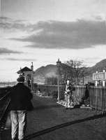 Piping the lament at Alva station on 1 November 1954, the last day of passenger services. [See image 29201]<br><br>[Frank Inglis Collection 01/11/1954]