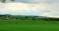 A class 170 rounds the long bend through Kingskettle, heading for Ladybank.<br><br>[Brian Forbes 14/05/2007]