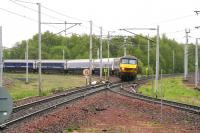 <h4><a href='/locations/C/Carstairs'>Carstairs</a></h4><p><small><a href='/companies/C/Caledonian_Railway'>Caledonian Railway</a></small></p><p>Crossing the up WCML on the approach to Carstairs station at 0835 on 17 May 2007 is EWS 90026 with the empty stock of the Edinburgh portion of the Caledonian Sleeper. The train is heading for Polmadie depot. 37/42</p><p>17/05/2007<br><small><a href='/contributors/John_Furnevel'>John Furnevel</a></small></p>