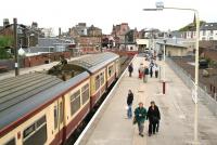 Looking towards the buffer stops at Largs station on 17 May 2007. View is from the footbridge, with a train from Glasgow just arriving at platform 2.<br><br>[John Furnevel 17/05/2007]