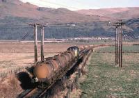 Trainload of molasses on its way to Glenochil Yeast, Menstrie, photographed near Tullibody in March 1986.<br><br>[Mark Dufton /03/1986]