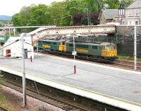 Freightliner locomotives 86621+86638 take the Coatbridge containers north out of Carstairs after being held for some time in the station loop on 24 May 2007. <br><br>[John Furnevel 24/05/2007]