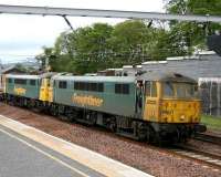 Driver takes the air at the cab door of 86621, held at Carstairs with the Basford Hall - Coatbridge containers, as he awaits a passing train - in this case a GNER Kings Cross - Glasgow Central service off the Edinburgh line.<br><br>[John Furnevel 24/05/2007]