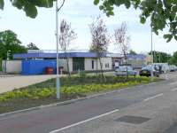 Northbound station entrance with cycle lockers, brown bins and taxis. <br><br>[Brian Forbes 27/05/2007]