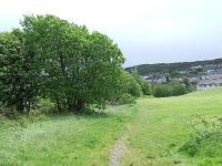 Looking east towards Upper Port Glasgow, it was at this approximate point that the line started its climb of 1 in 70 to Kilmacolm. The trackbed here at one time sat on an embankment.<br><br>[Graham Morgan 23/05/2007]