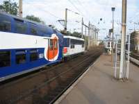 Loco-hauled double deck commuter train bound for Paris St Lazare<br><br>[Michael Gibb 23/05/2007]