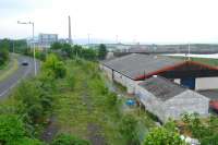 Methil number 3 dock is to the right (partly infilled) and the line from Kirkland Yard to Methil is in the foreground. Methil powerstation (closed) provides a backdrop.<br><br>[Ewan Crawford 02/06/2007]