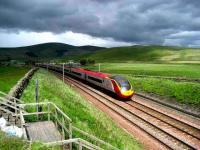 <I>Out of the darkness cometh light...</I> Southbound Pendolino at speed near Crawford on 25 May. <br><br>[John McIntyre 25/05/2007]