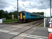 Northern Trains 156 crosses Floriston LC heading south towards Carlisle on 25 May. The destination panel shows Cleethorpes! <br><br>[John McIntyre 25/05/2007]